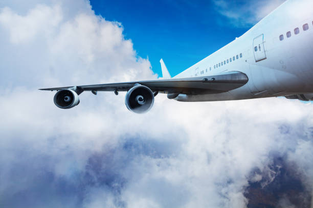 istock Wing and jet engines crop of an airplane flying 1349410496