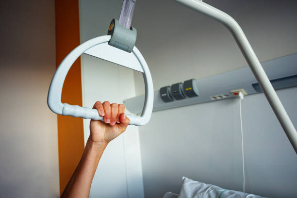 Blurred hospital room, unfocused background.