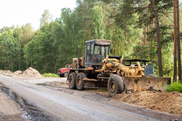 istock Old grader on the sideroad of new road 1349411686