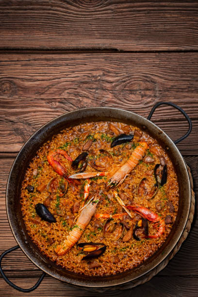 istock Seafood paella on rustic wood vertical 1349412249
