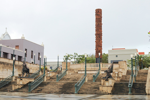 San Juan, Puerto Rico-February 01,2014:Front view at the Plaza del Quinto,Centenario Quincentennial Square,with two bronze lambs and The totem,made of black granite and Taino ceramic pieces