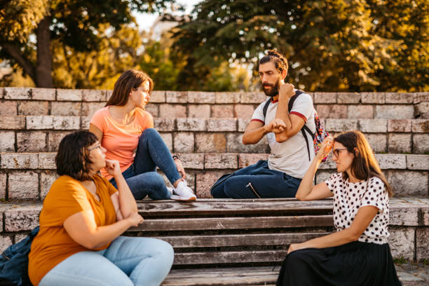 istock Friends speak in sign language 1349420999