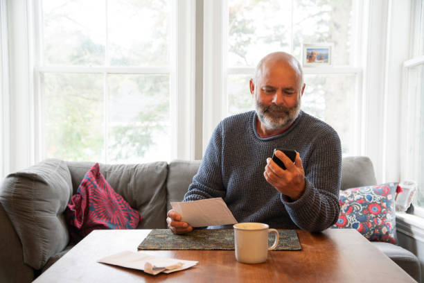 istock A mature man dealing with personal finances at home 1349422115