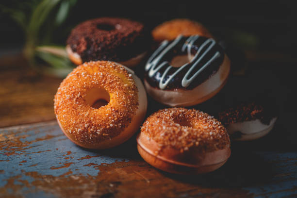 Donut For Breakfast On Wood Board Donut For Breakfast On Wood Board DONUT stock pictures, royalty-free photos & images