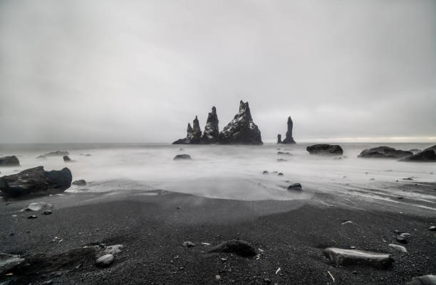 istock Basalt rock formations Troll toes on black beach. at storm Reynisdrangar, Vik, Iceland 1349424930