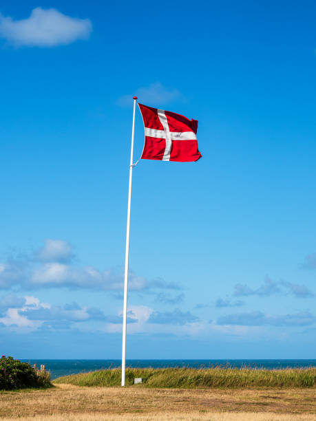 The flag of Denmark with blue sky.