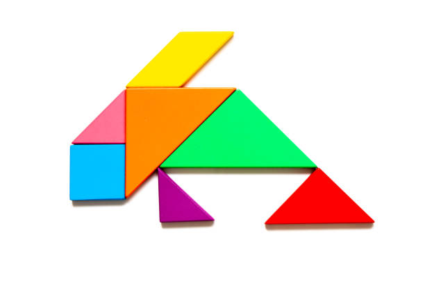 istock Color tangram puzzle in fish shape on white background 1349426430