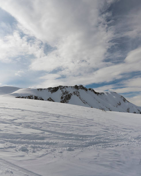 istock White sunny snow mountain landscapes 1349430776