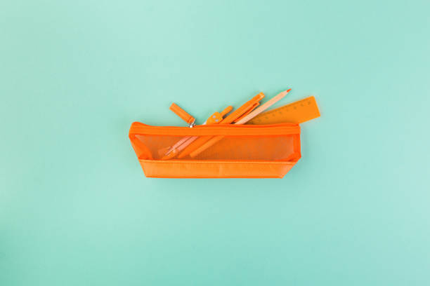 istock Different orange school supplies in case. Back to school concept. Flat lay, top view, copy space 1349432149