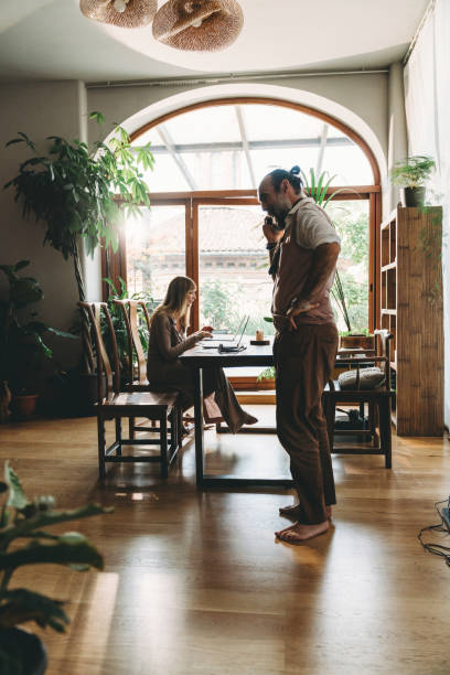 istock Two mid adults business people are working in their office 1349433739