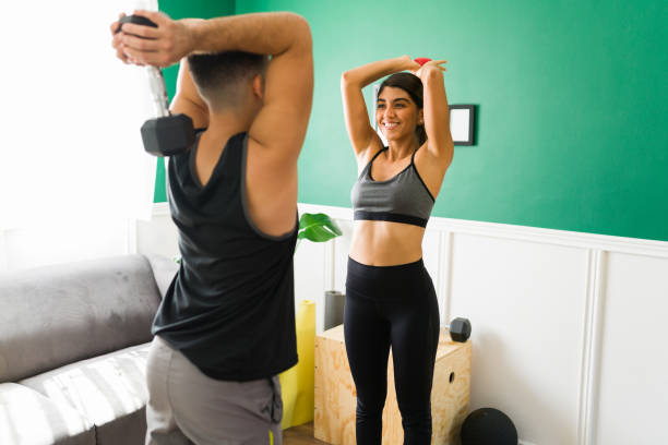 istock Beautiful woman exercising with a workout partner 1349433974
