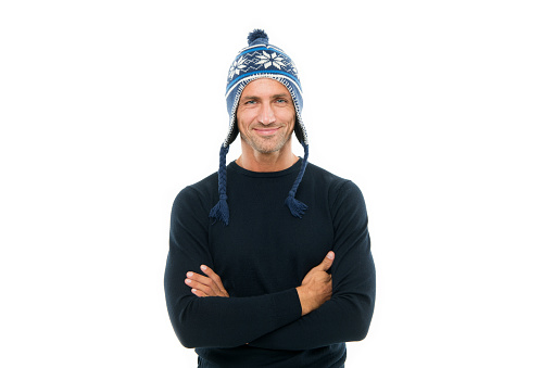 confident in his style. christmas and new year vacation. handsome man smiling in winter hat. mature man isolated on white. knitted fashion accessory for men. happy man ready for winter season.