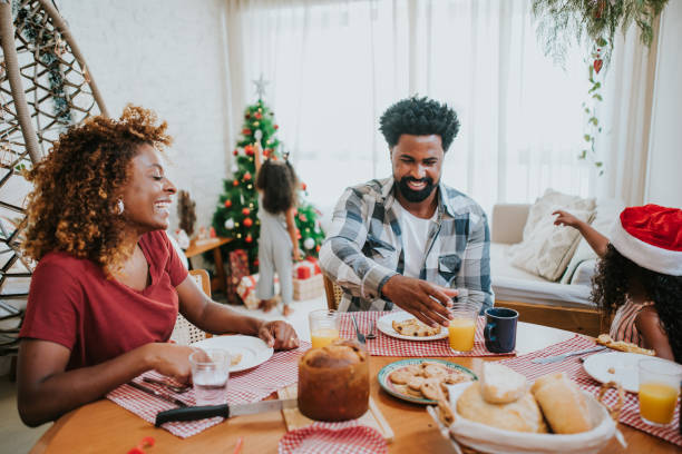 istock Happy family celebrating Christmas at home 1349437708