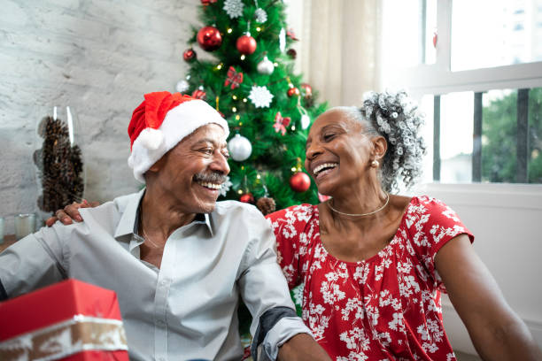 istock Happy elderly couple on Christmas at home. 1349438509