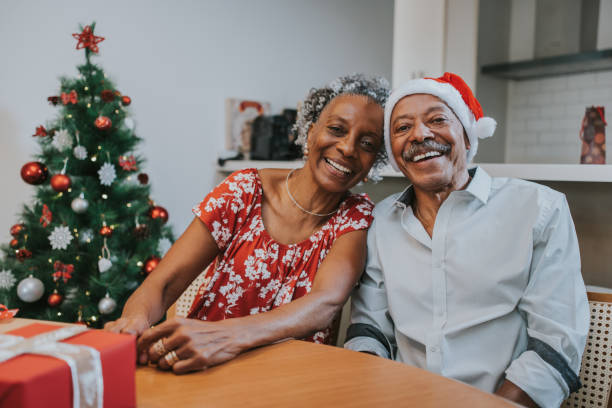 istock Happy elderly couple on Christmas at home. 1349438521