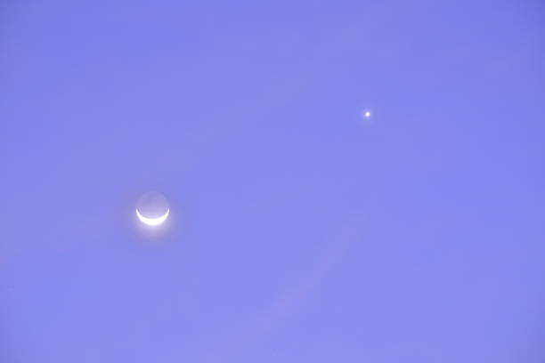 istock Crescent Moon and Venus in clear blue sky. 1349439451