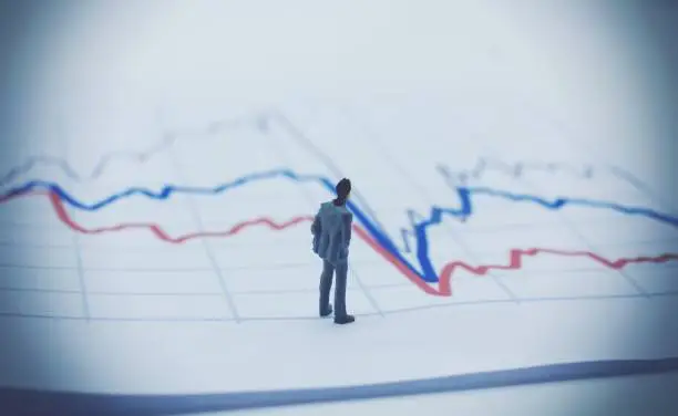 Photo of Man watching a stock graph