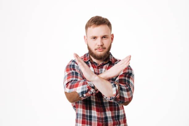 istock Serious Bearded man in shirt showing stop sign 1349441494