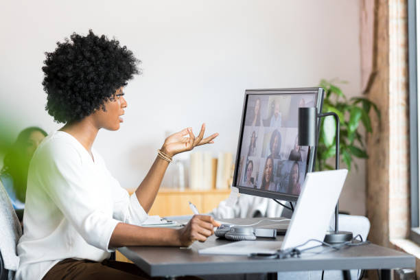 istock Meeting virtually with colleagues, woman gestures during presentation 1349443313