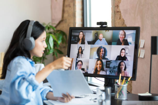 istock Female boss leads virtual staff meeting 1349443323