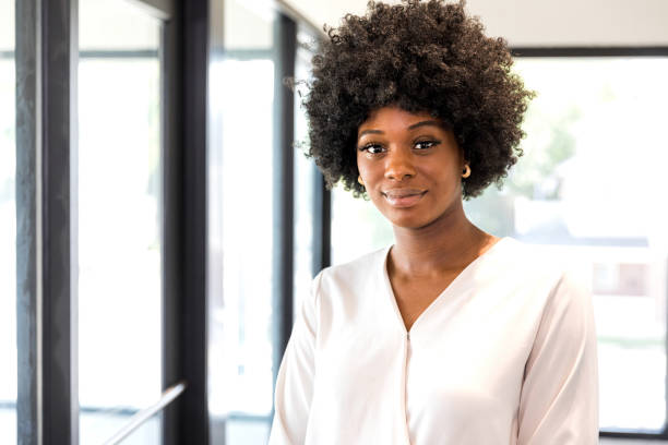 istock Standing outside her office, female therapist looks at camera 1349443355