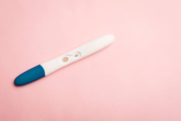 istock Pregnancy test on a pink background . Positive test. Pregnancy copy space. 1349445162