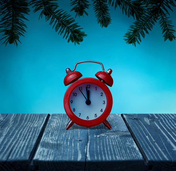 istock Alarm clock on wooden plank 1349447525