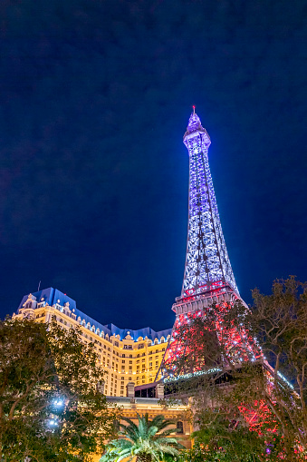 Las Vegas, USA - March 10, 2019: the replica of the eiffel tower at the Strip is illuminated by night in Las Vegas.