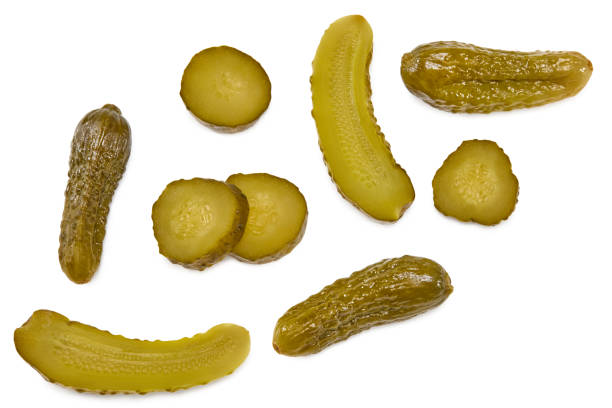 istock marinated pickled cucumbers with slices isolated on white background. Clipping path and full depth of field. Top view 1349455149