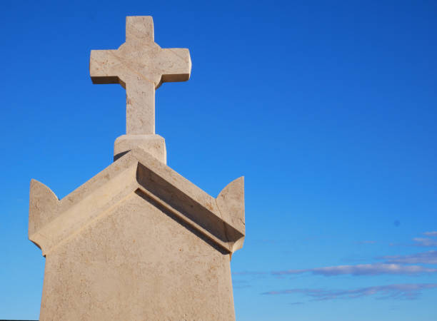 istock Religious cross in stone with a view from below 1349455957