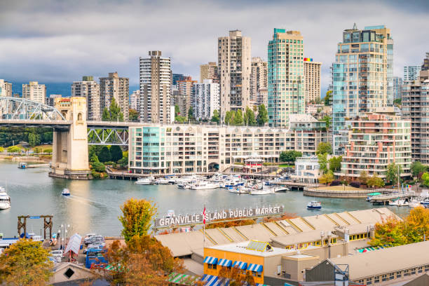 Vancouver Canada Downtown Granville Island Public Market False Creek condos and Granville Island Public Market in downtown Vancouver, British Columbia, Canada. granville island stock pictures, royalty-free photos & images