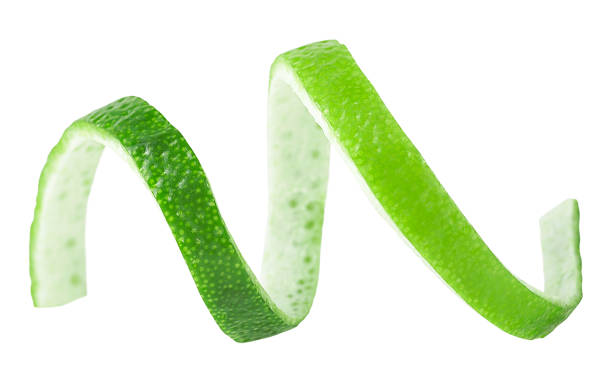 istock Peel of fresh green lime isolated on a white background. Curly lime twist. 1349461401