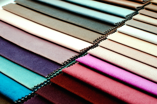 Colorful samples of upholstery fabrics, close-up.