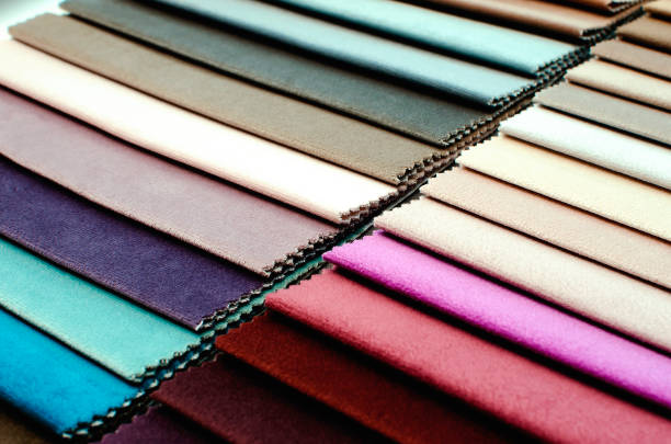 Colorful samples of upholstery fabrics, close-up. Colorful samples of upholstery fabrics, close-up. fake leather stock pictures, royalty-free photos & images