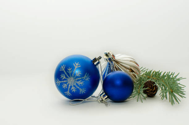istock Branch of a Christmas tree with decorations on a white background. Space for text, copy-space. 1349461959