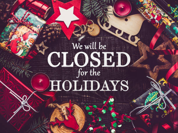 We'll be closed for the holidays. Signboard Signboard with the inscription We will be closed for the holidays. View from above, closeup, indoors, no people. Studio photo. Congratulations for family, relatives, friends and colleagues closed stock pictures, royalty-free photos & images