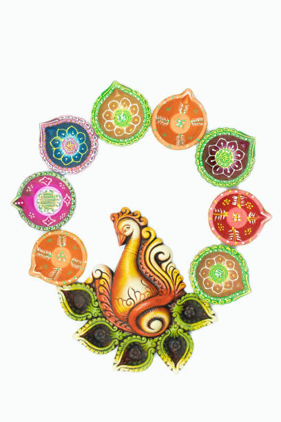 istock Decorative Multicolor Diya, Deep Or Dia Arranged As Peacock With Open Wings. White Background With Copy Space. Theme For Diwali, Navratri Pooja, Dussehra Puja, Ganesh Chaturthi, Shubh Deepawali 1349463898