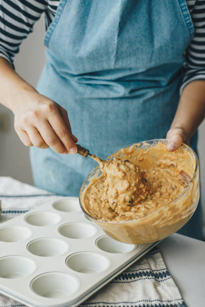 istock Woman making muffins at home 1349464026