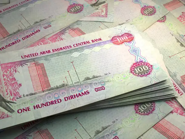 Money of United Arab Emirates. United Arab Emirates dirham bills. AED banknotes. 100 dirhams. Business, finance, news background.