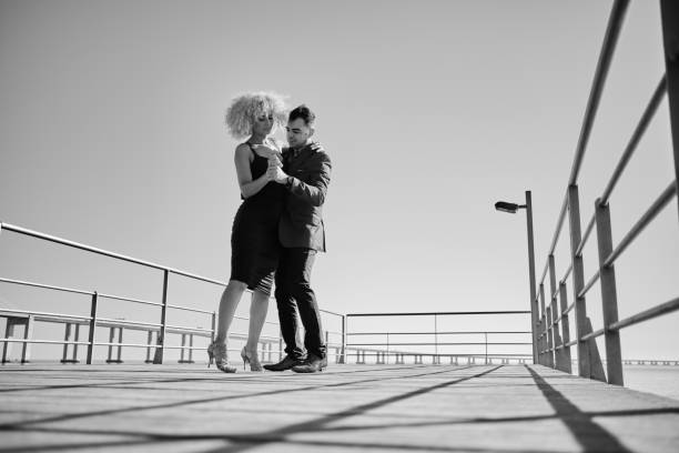 istock Couple dancing on the pier 1349468402