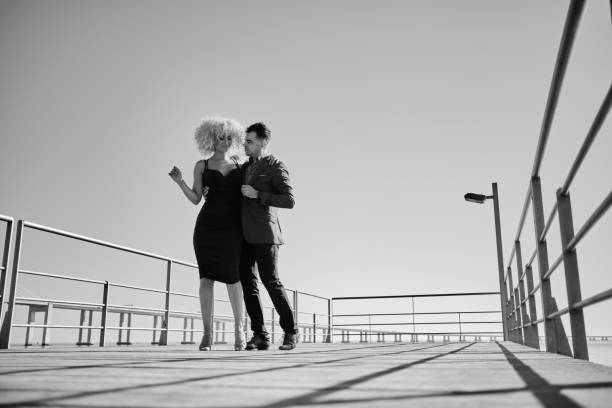 istock Couple dancing on the pier 1349468505