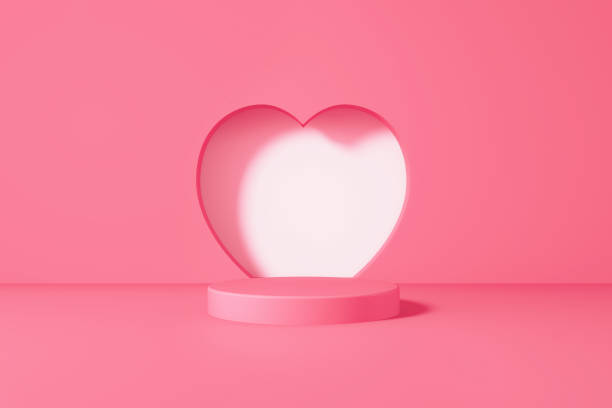 istock Pink Podium Sitting Before White Cut Out Heart Shape On Pink Background 1349471004