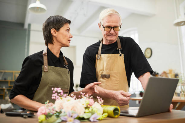 istock Mature Couple Managing Business 1349471993