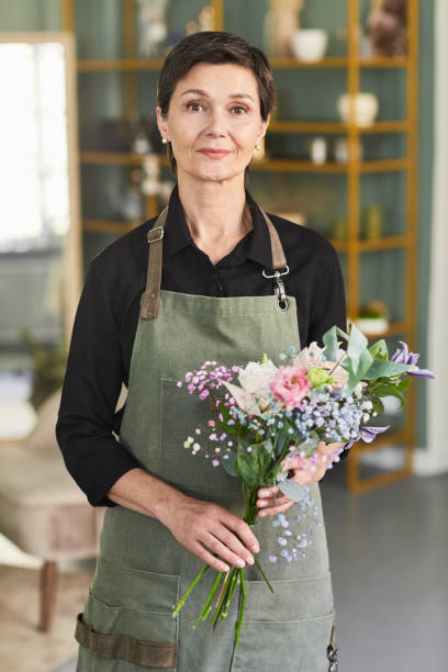 istock Mature Female Florist Smiling 1349472190