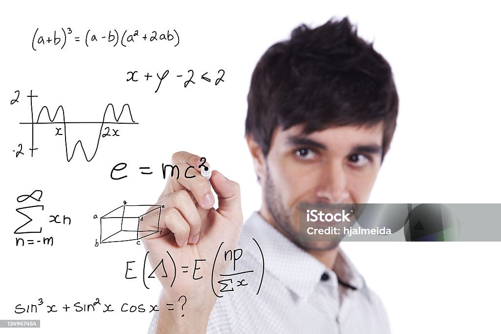 mathematics teacher mathematics teacher writing formulas on the whiteboard (selective focus) Mathematician Stock Photo
