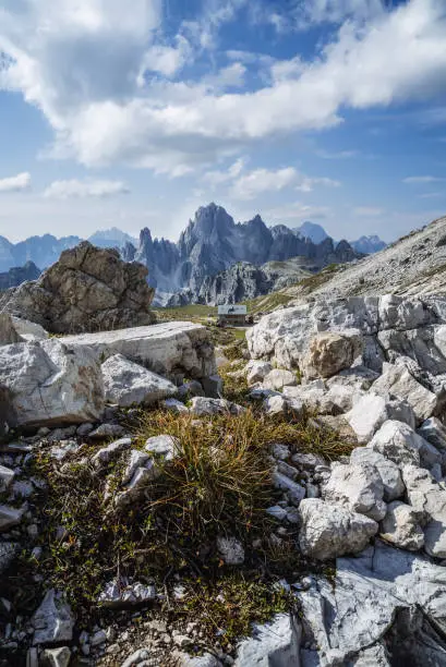 Rifugio Lavaredo with Cadini di Misurina mountain group in background. Dolomites at the Cime di Lavaredo, Italy.