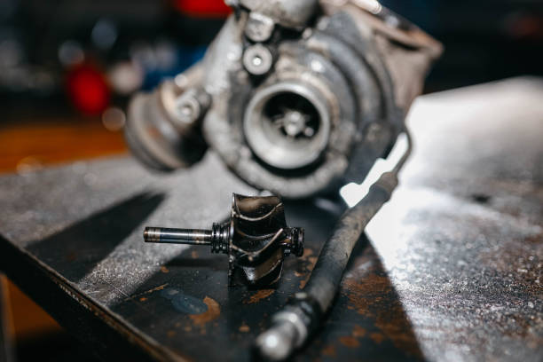 diagnostics and repair of a turbine of a car engine, a turbocharger. stock photo