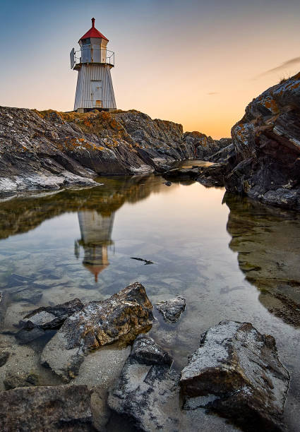 istock Tidal pool infront of lighthouse on Vigra, Norway 1349481171
