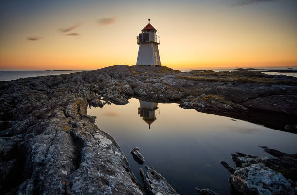 istock Golden sunset with lighthouse, Vigra, Norway 1349481175