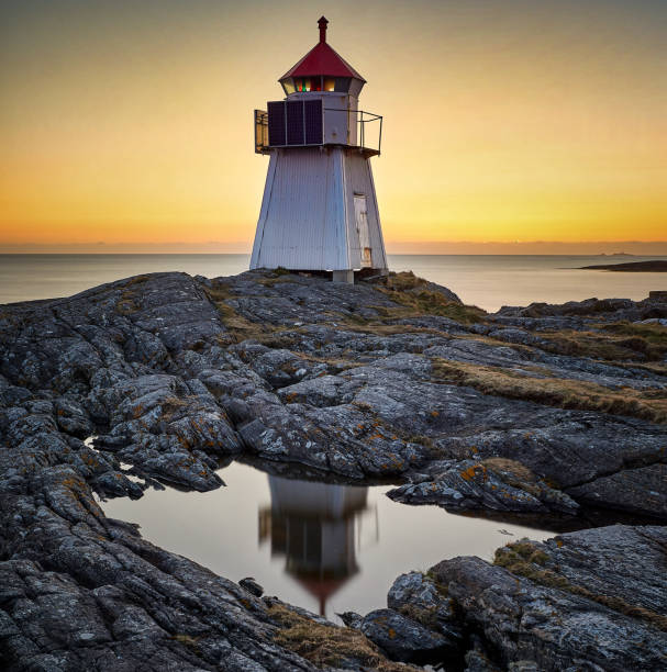 istock Golden sunset with lighthouse, Vigra, Norway 1349481227